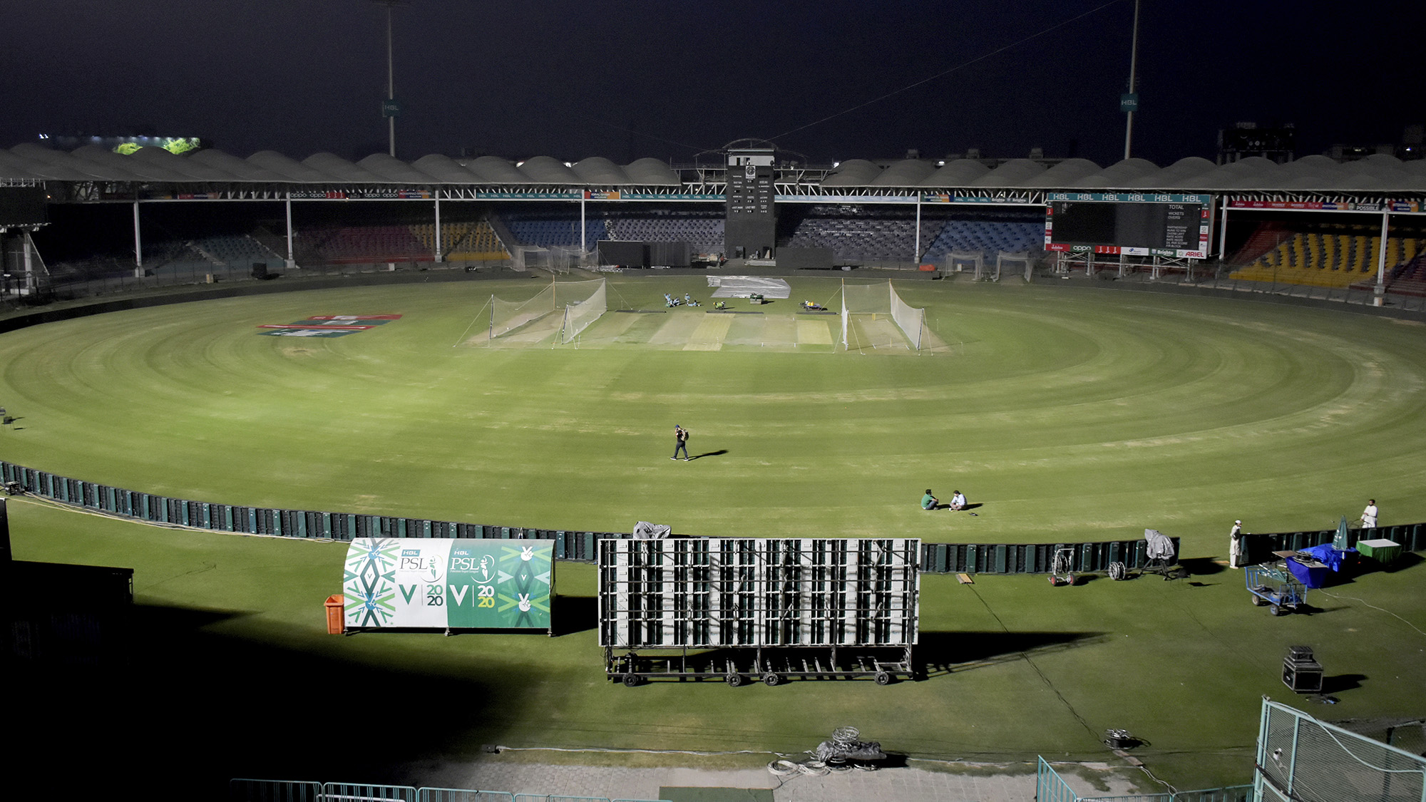 Groundsmen finalize the arrangements for upcoming first match of Pakistan Super League T20 cricket tournament at the National Stadium, in Karachi, Pakistan on February 19, 2021. (AP)