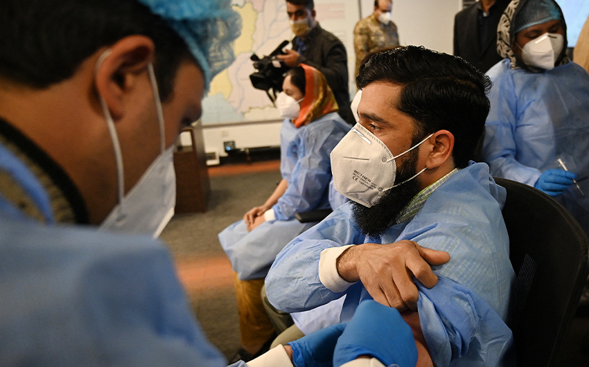 A health worker receives a dose of the Chinese-made Sinopharm Covid-19 vaccine, at the National Command and Operation Center (NCOC) in Islamabad, Pakistan, on February 3, 2021. (AFP/File)