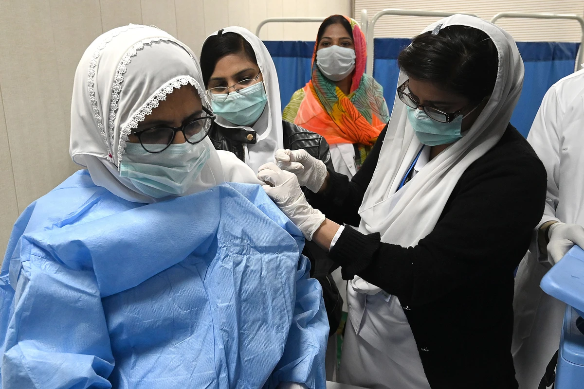 A doctor receives a dose of the Chinese-made Sinopharm Covid-19 vaccine, at a vaccination centre in Lahore on February 3, 2021. (AFP)
