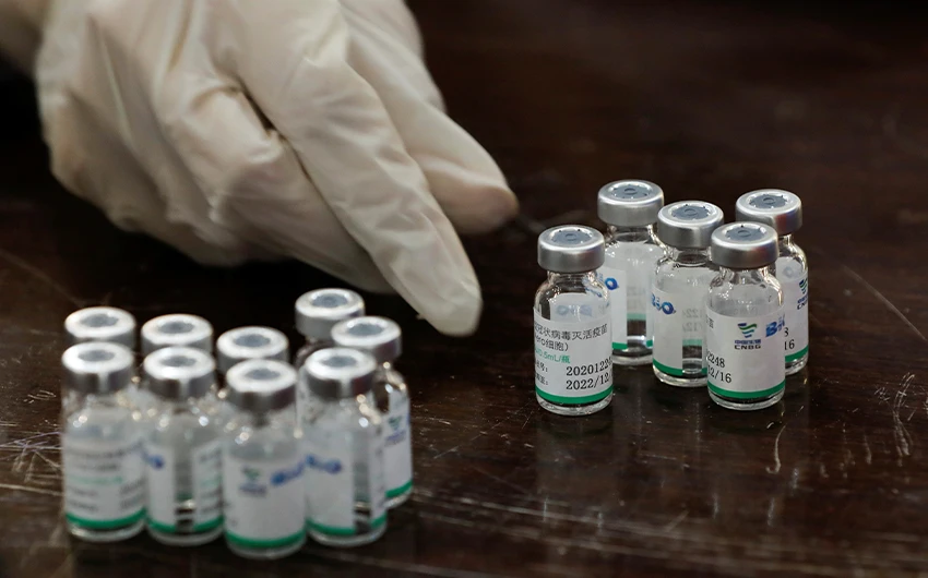 A health worker counts used vials of Sinopharm's coronavirus disease (COVID-19) vaccine, at a vaccination center in Karachi, Pakistan February 11, 2021. (REUTERS)