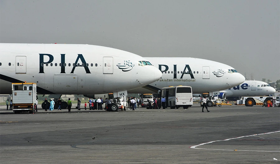 Pakistan International Airline (PIA) planes are positioned on the tarmac at the Benazir Bhutto International Airport in Islamabad on October 10, 2012. (AFP)