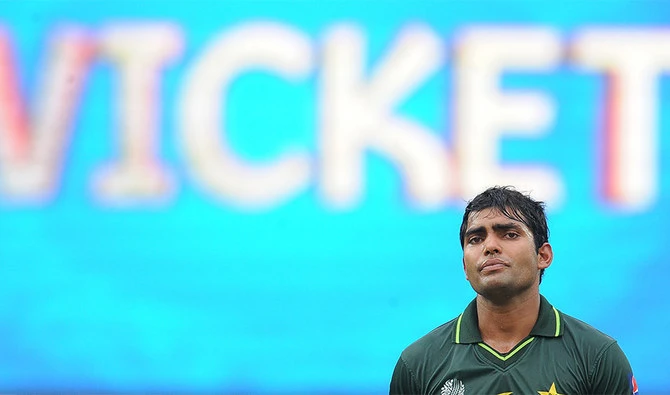 Pakistan batsman Umar Akmal walks back to the pavilion after his dismissal during the Group A match against Canada in the Cricket World Cup tournament at the R. Premadasa Stadium in Colombo on March 3, 2011. (AFP)