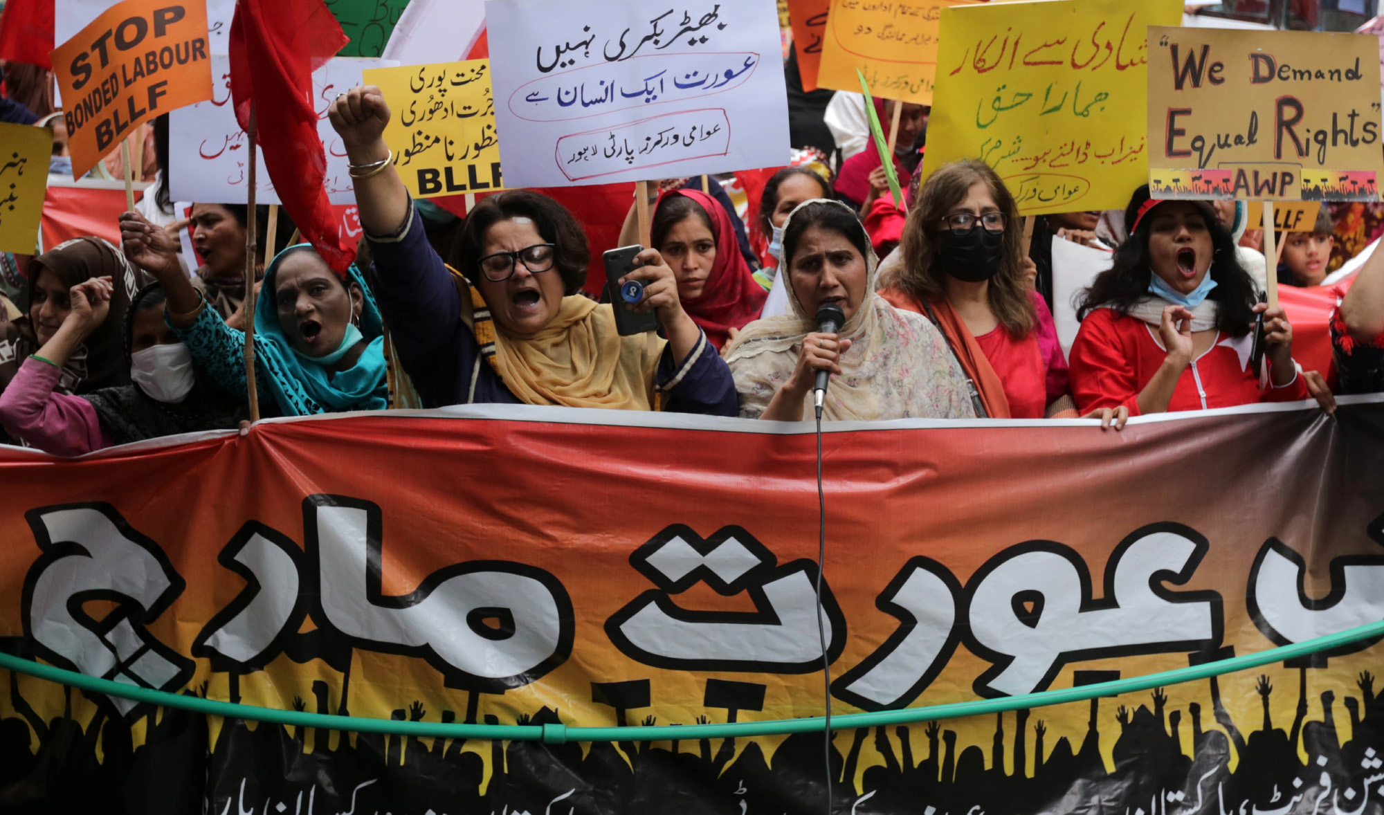 Activists of Pakistan trade unions attend a rally, ahead of International Women's Day in Lahore, Pakistan on March 7, 2021. (EPA)