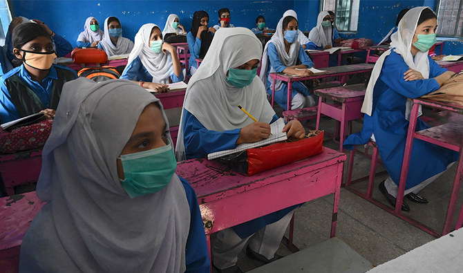 Students wearing facemasks attend a class at a government school in Lahore on September 15, 2020 after the educational institutes were reopened nearly six months after the spread of the Covid-19 coronavirus. (AFP/ File)