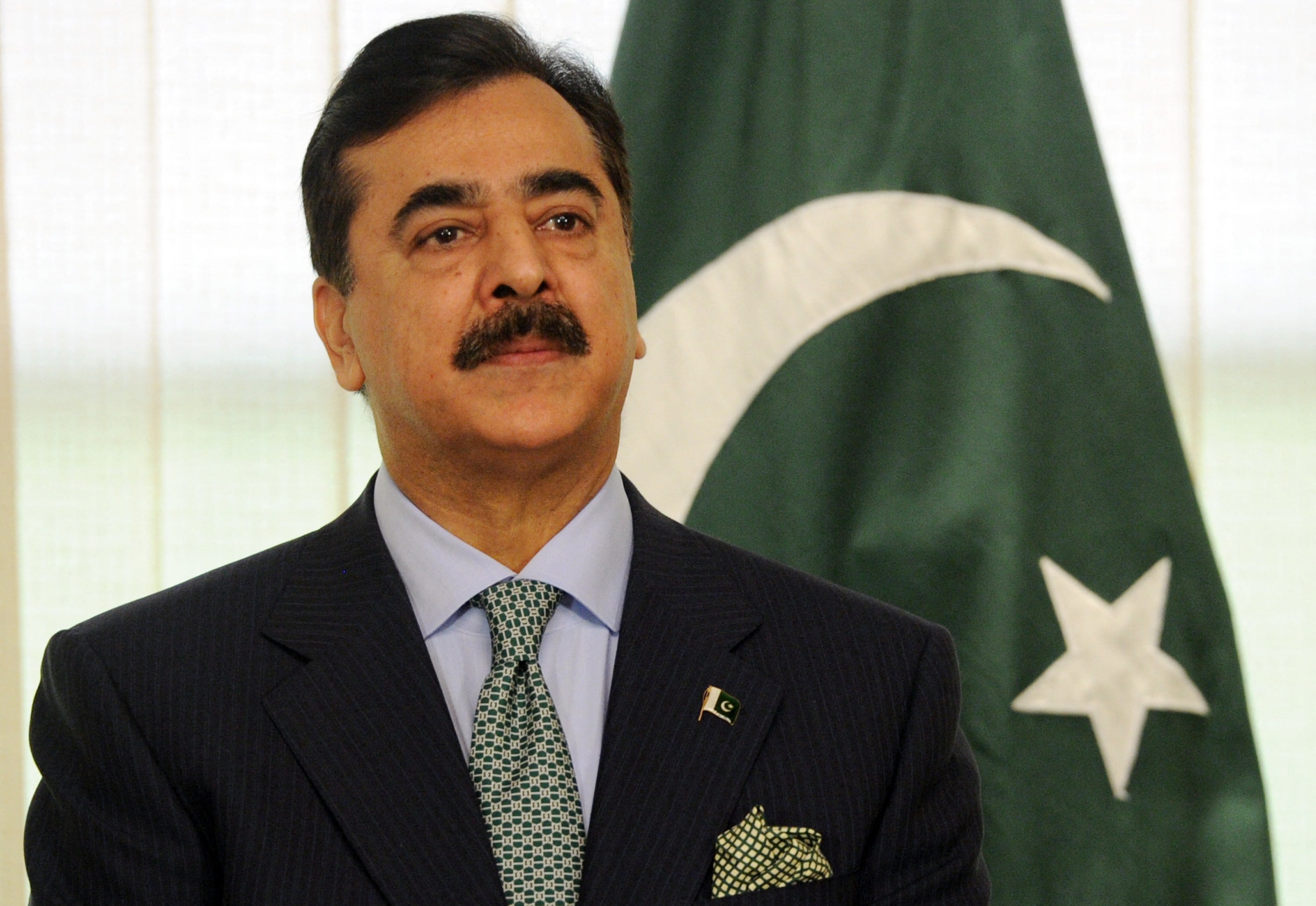 Former Pakistani Prime Minister Yousuf Raza Gilani attends a signing of a memorandum of understanding (MOU) with Sri Lankan President Mahinda Rajapakse at The Prime Minister House in Islamabad on February 11, 2012.