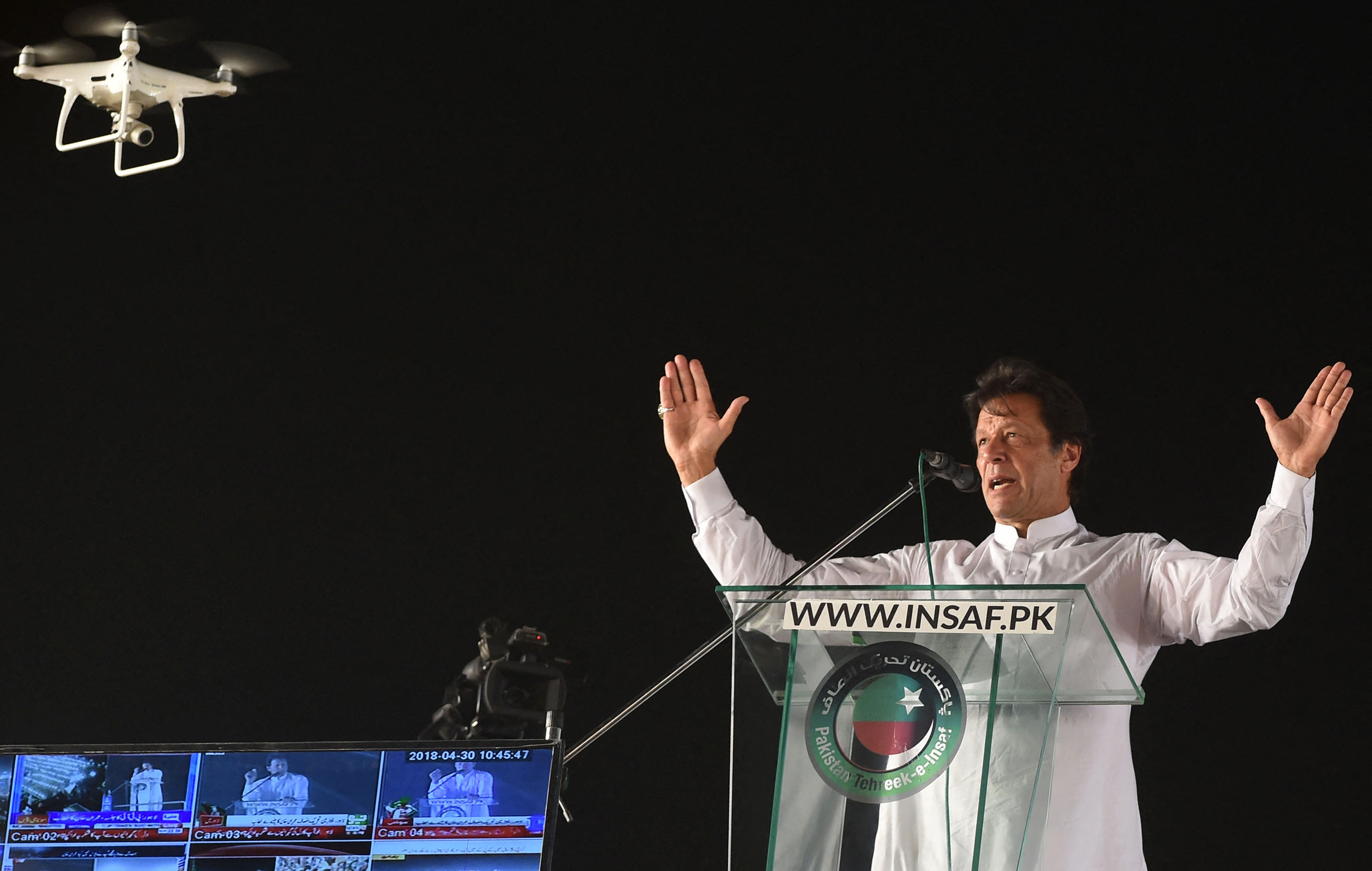 Pakistan Prime Minister Imran Khan delivers speech during a political rally, as a drone record him in Lahore, Pakistan. on April 29, 2018. (AFP/File)