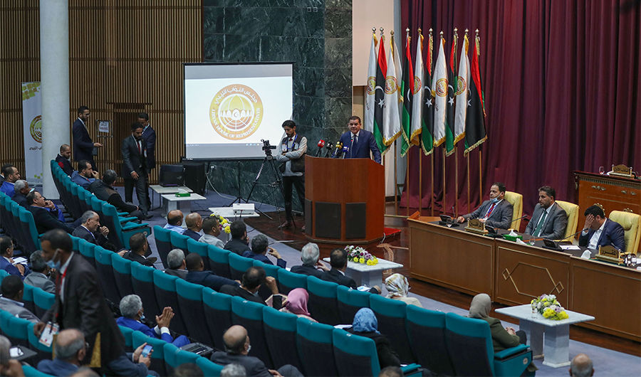 Libya's prime minister-designate Abdul Hamid Dbeibah addresses lawmakers during the first reunited parliamentarian session, in the coastal city of Sirte east of the capital, on March 9, 2021. (AFP/File)