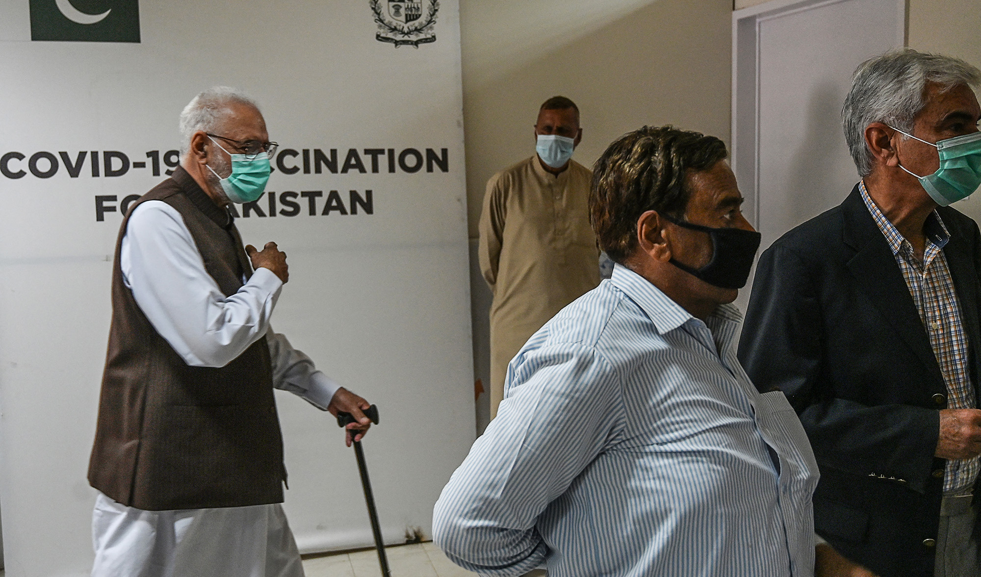 Senior citizens wait to receive a COVID-19 vaccine, at a vaccination center in Islamabad, Pakistan on March 10, 2021. (AFP)