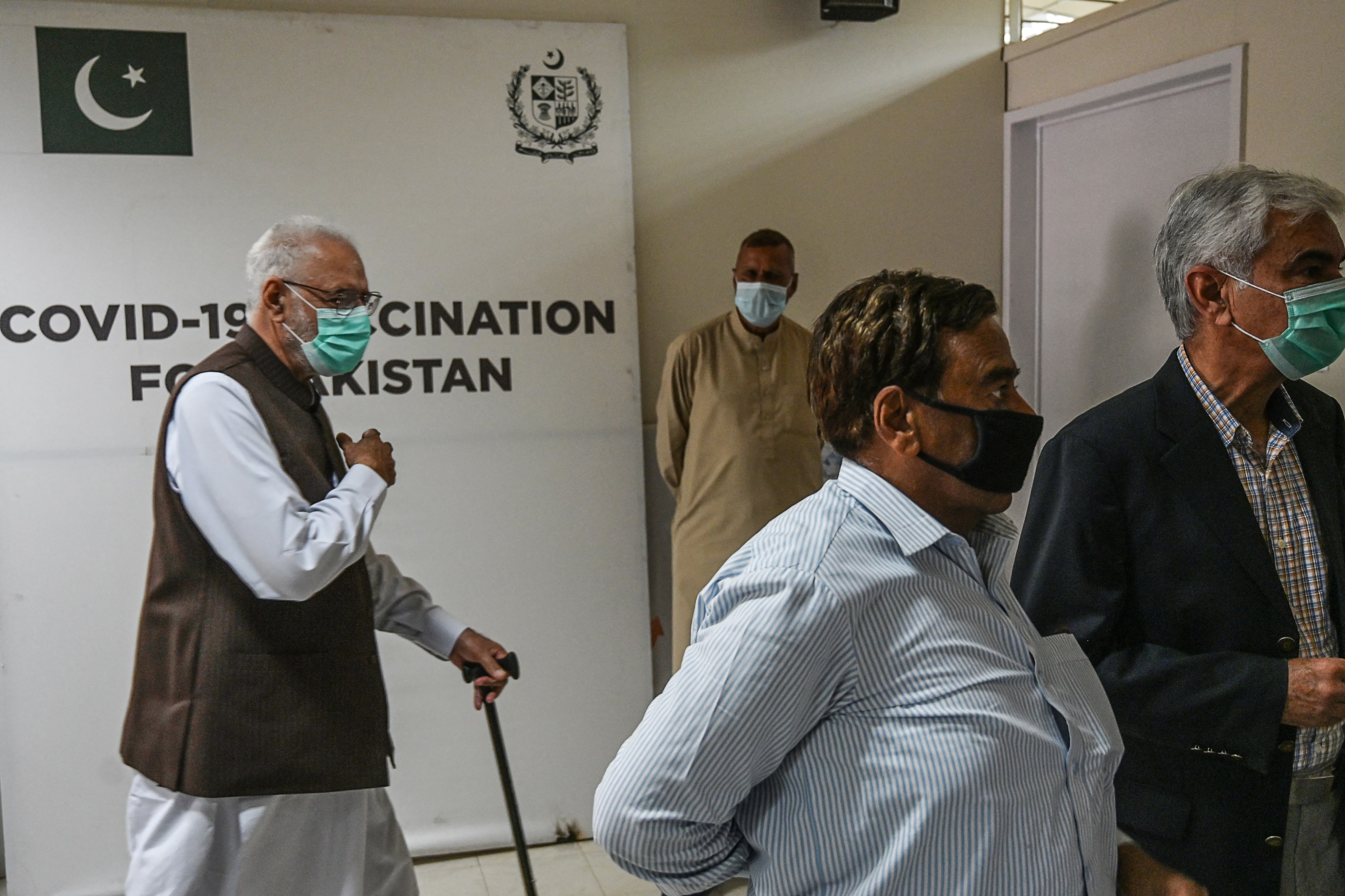 Senior citizens wait to receive a Chinese-made Sinopharm vaccine against the Covid-19 coronavirus, at a vaccination centre in Islamabad on March 10, 2021. (AFP)