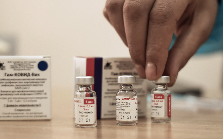 A Palestinian health worker displays vials of the Russian Sputnik V COVID-19 vaccine in Gaza City on March 22, 2021. (AFP/File)