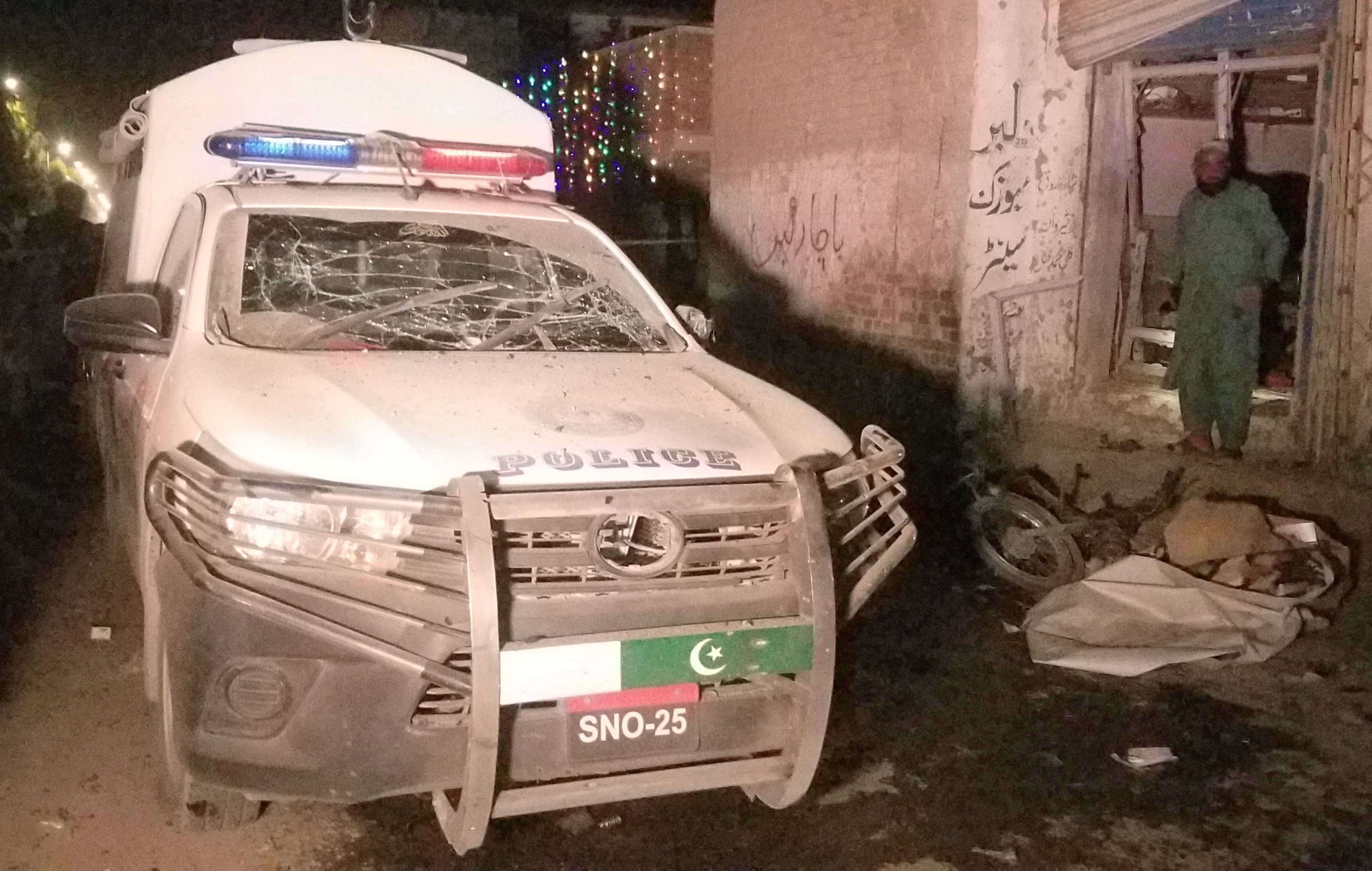 A damaged police vehicle is seen after a remote controlled bomb blast in Pakistan-Afghanistan border town of Chaman, Pakistan March 23, 2021. (REUTERS)