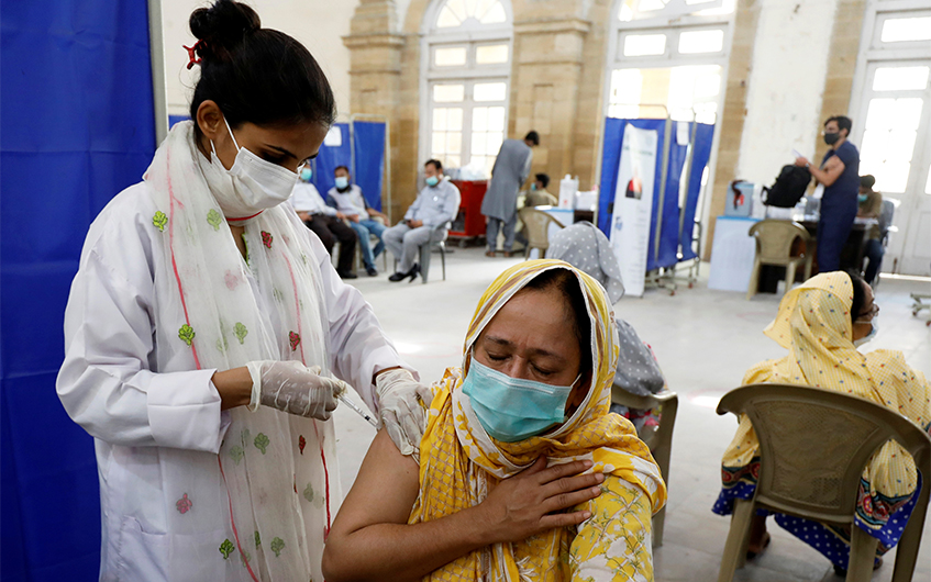 A resident receives a dose of coronavirus disease (COVID-19) vaccine, at a vaccination center in Karachi, Pakistan March 22, 2021. (REUTERS)
