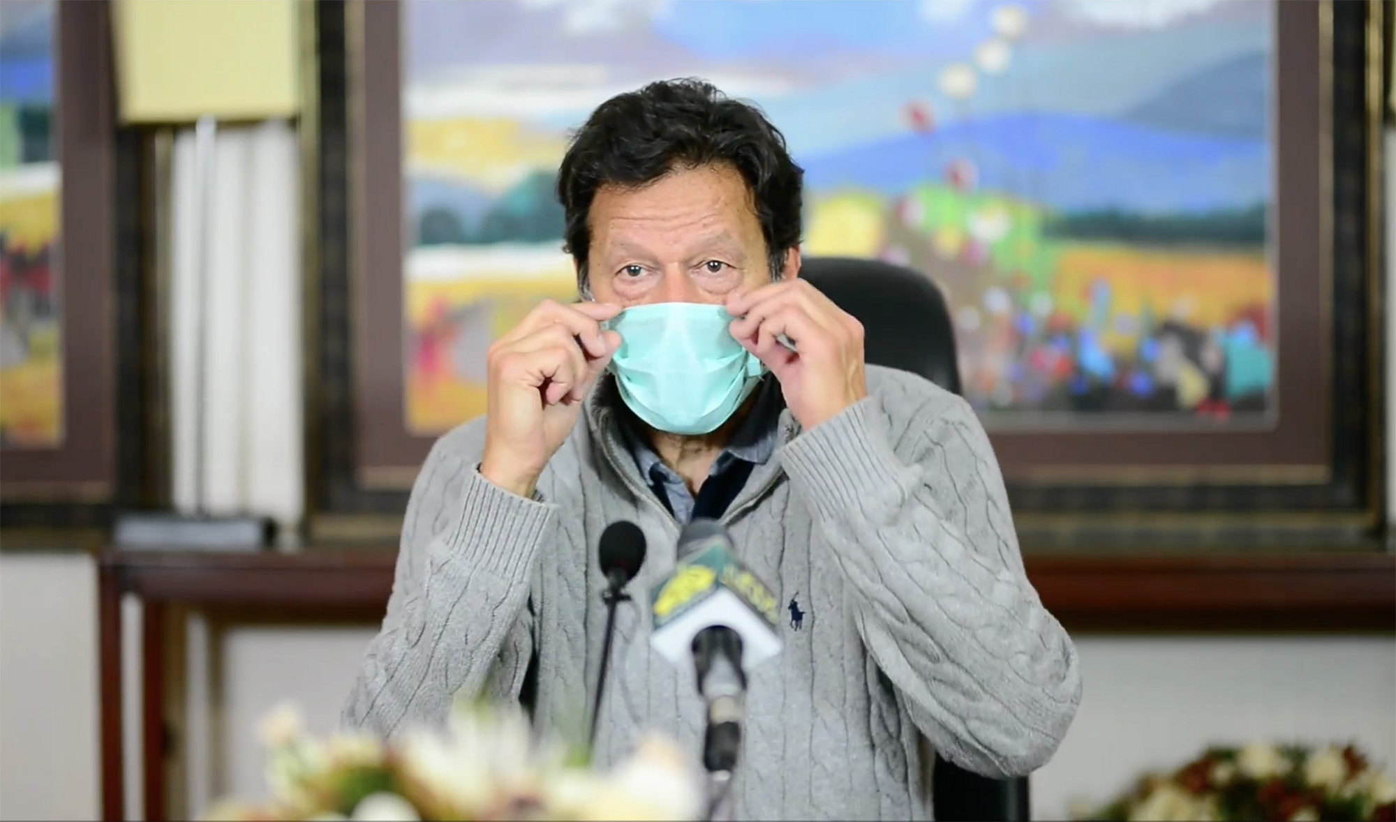 Pakistan Prime Minister Imran Khan urging people to wear face masks, for protection from COVID-19 coronavirus, during a televised address on March 28, 2021. (Photo courtesy: ImranKhanOfficial/Facebook)