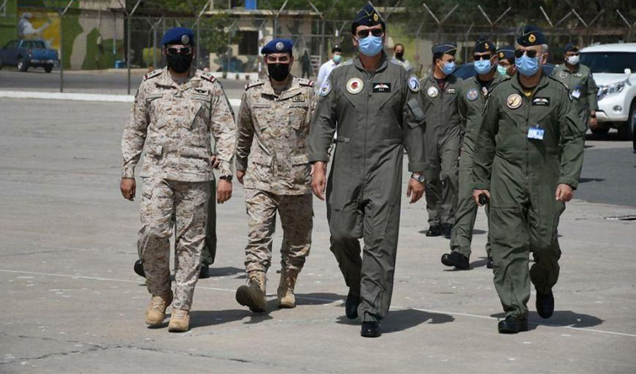 Saudi Royal Air Force (RSAF)'s officials walk with Pakistan Air Force (PAF) officials at Mushaf Airbase, Pakistan to participate in 2021 Air Excellence Center Exercise on March 28, 2021. (Photo courtesy: Saudi Press Agency)