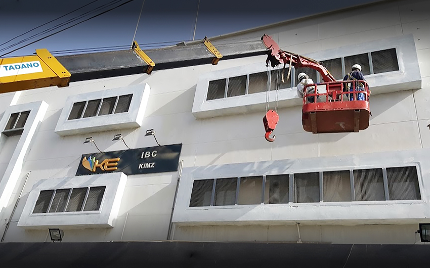 In this file photo, two technicians work outside the K-Electric building in Karachi, Pakistan, on September 2018. (Photo courtesy: Online)