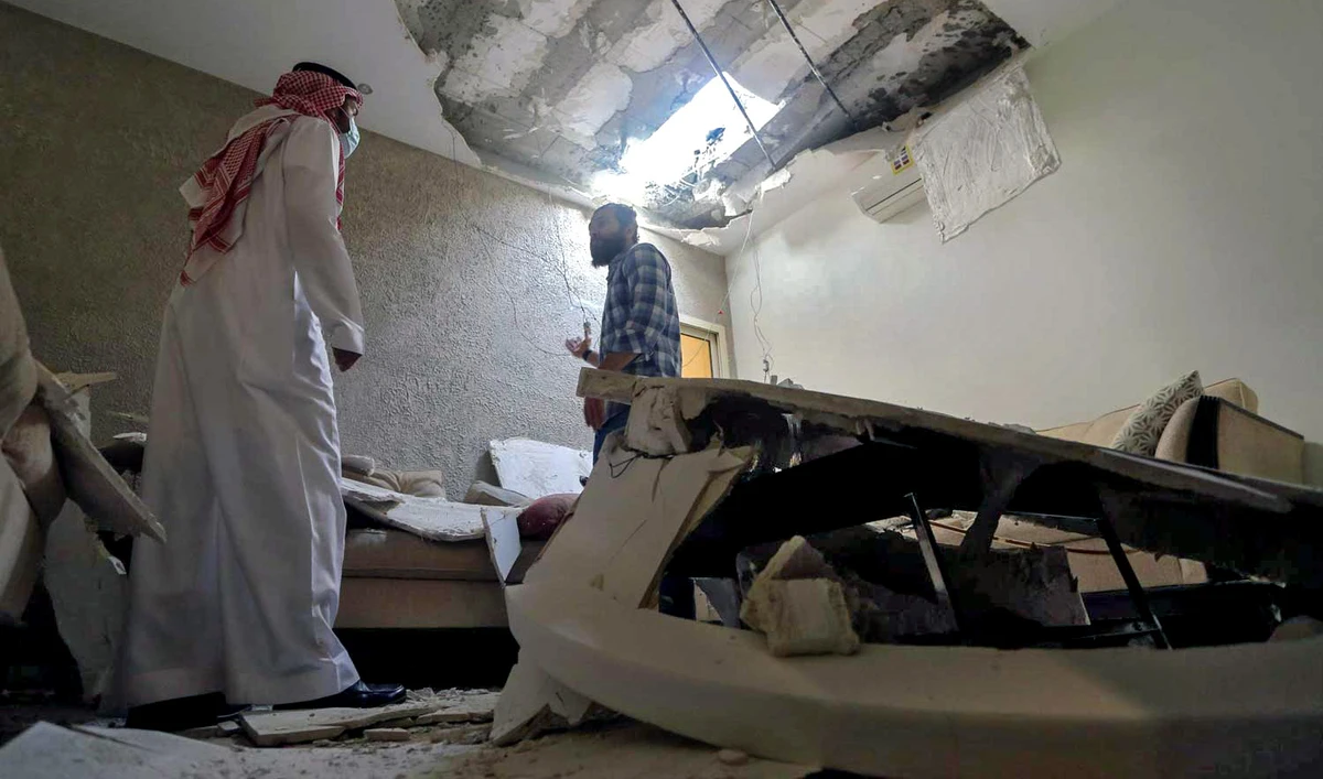 Mohamed Fahim inspects his house that was damaged by an intercepted missile in the aftermath of what Saudi-led coalition said was a thwarted Houthi missile attack, in Riyadh, Saudi Arabia, on February 28, 2021. (REUTERS/File)