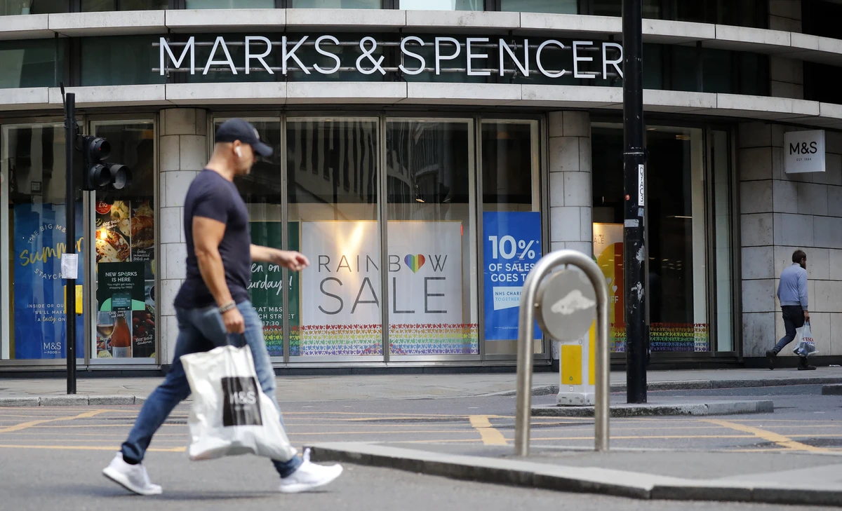 A pedestrian walks past an M&S (Marks and Spencer) store in central London on July 20, 2020. (AFP/ File)