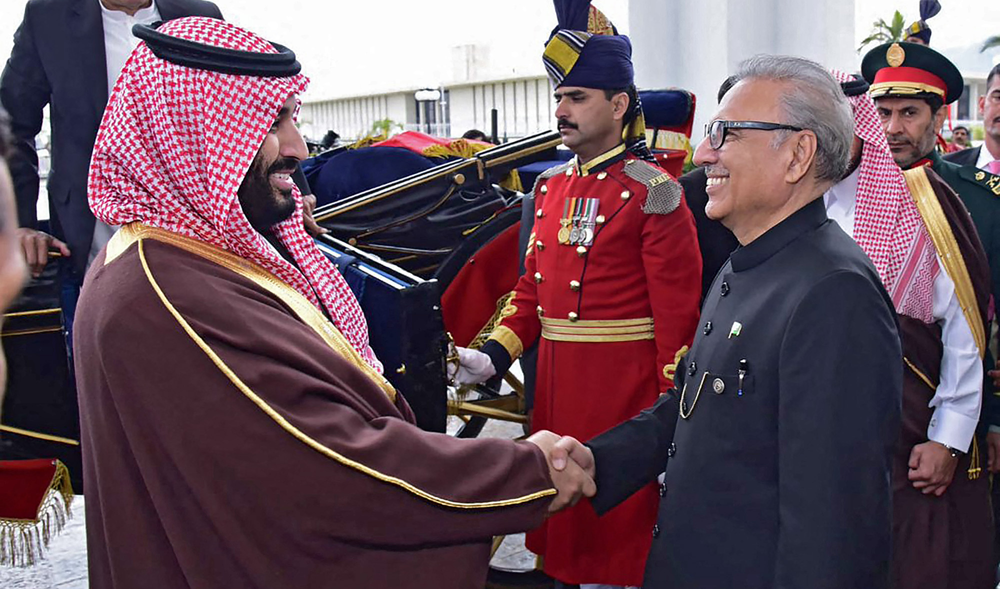 Pakistan's President Arif Alvi, right, shakes hands with Saudi Arabian Crown Prince Mohammed bin Salman at the President House in Islamabad, Pakistan, on February 18, 2019. (AFP/File)