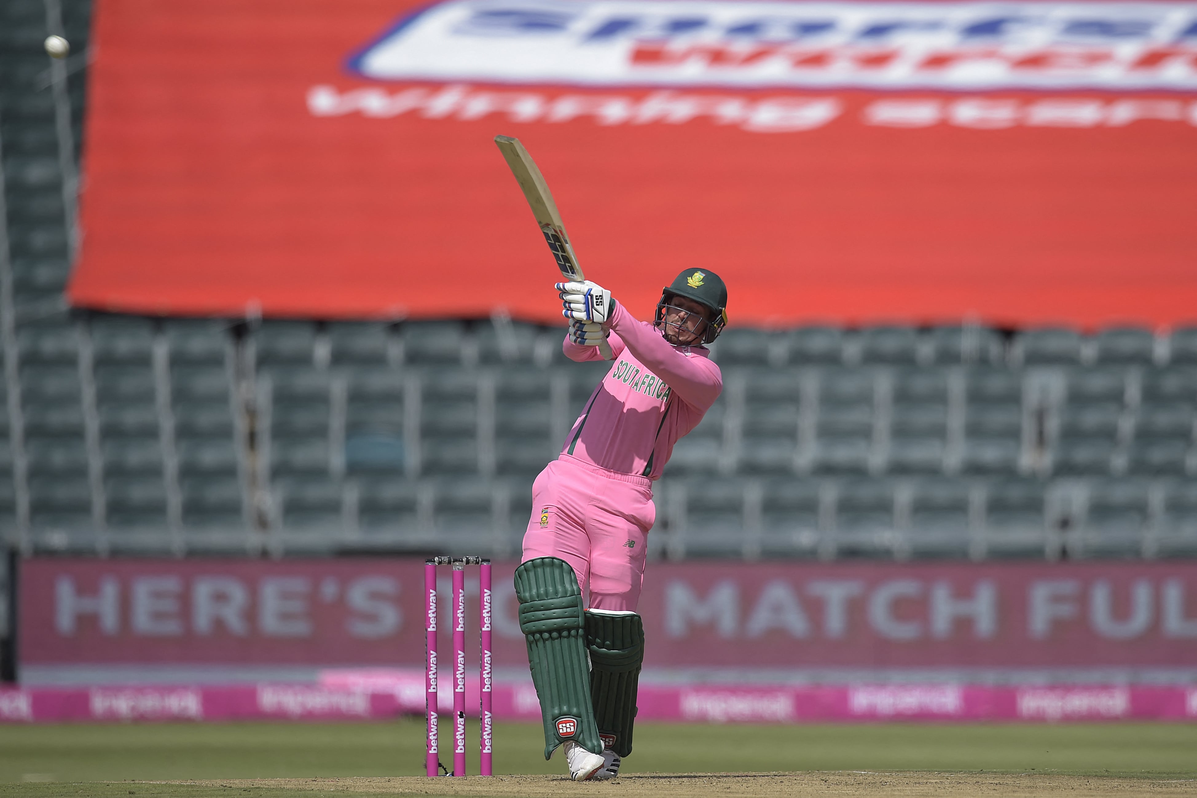 South African wicketkeeper Quinton de Kock hits a six during the second one-day international (ODI) cricket match between South Africa and Pakistan at Wanderers Stadium in Johannesburg on April 4, 2021.(AFP)