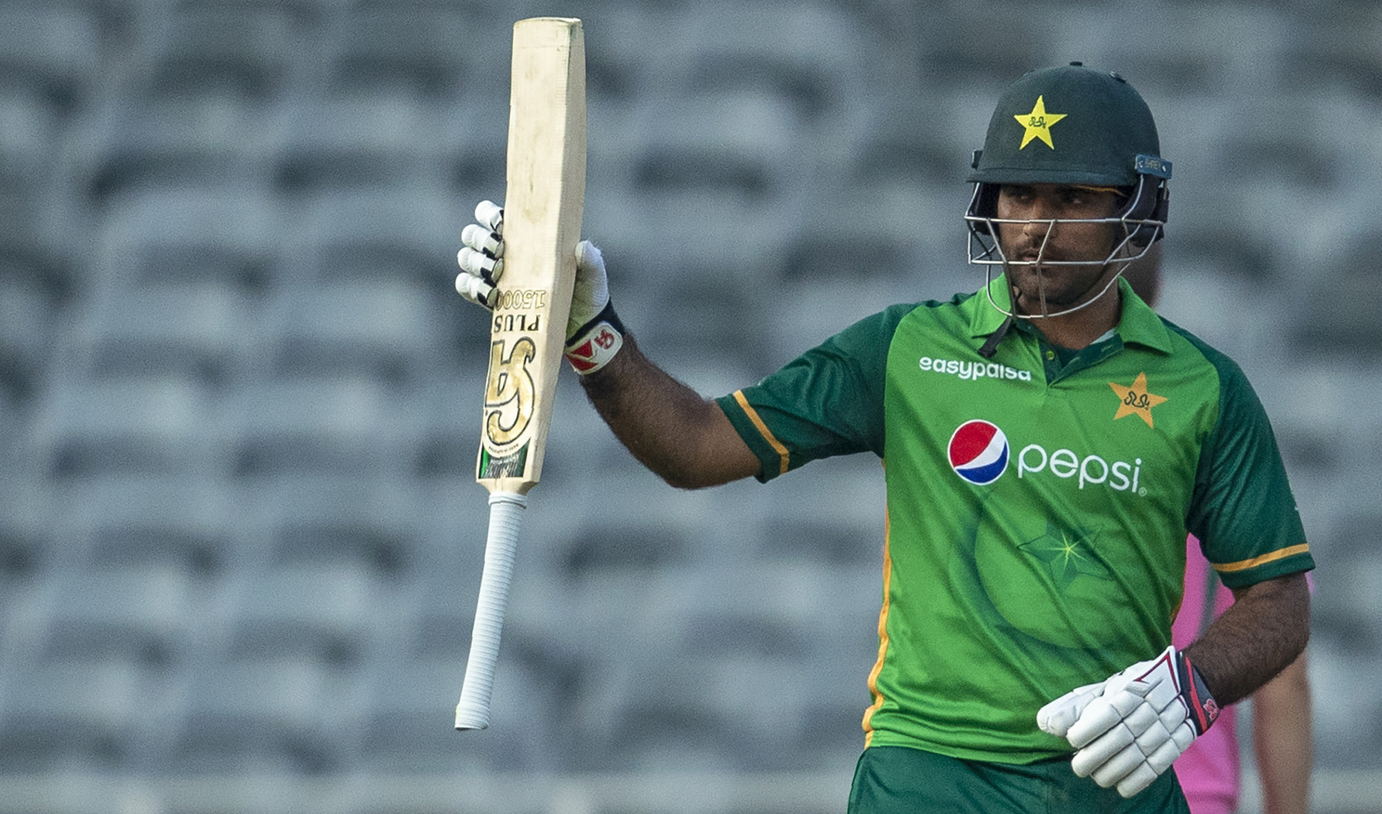 Pakistan's batsman Fakhar Zaman raises his bat to celebrate scoring a century during the second One Day International cricket match between South Africa and Pakistan at the Wanderers stadium in Johannesburg, South Africa, on April 4, 2021. (AP)