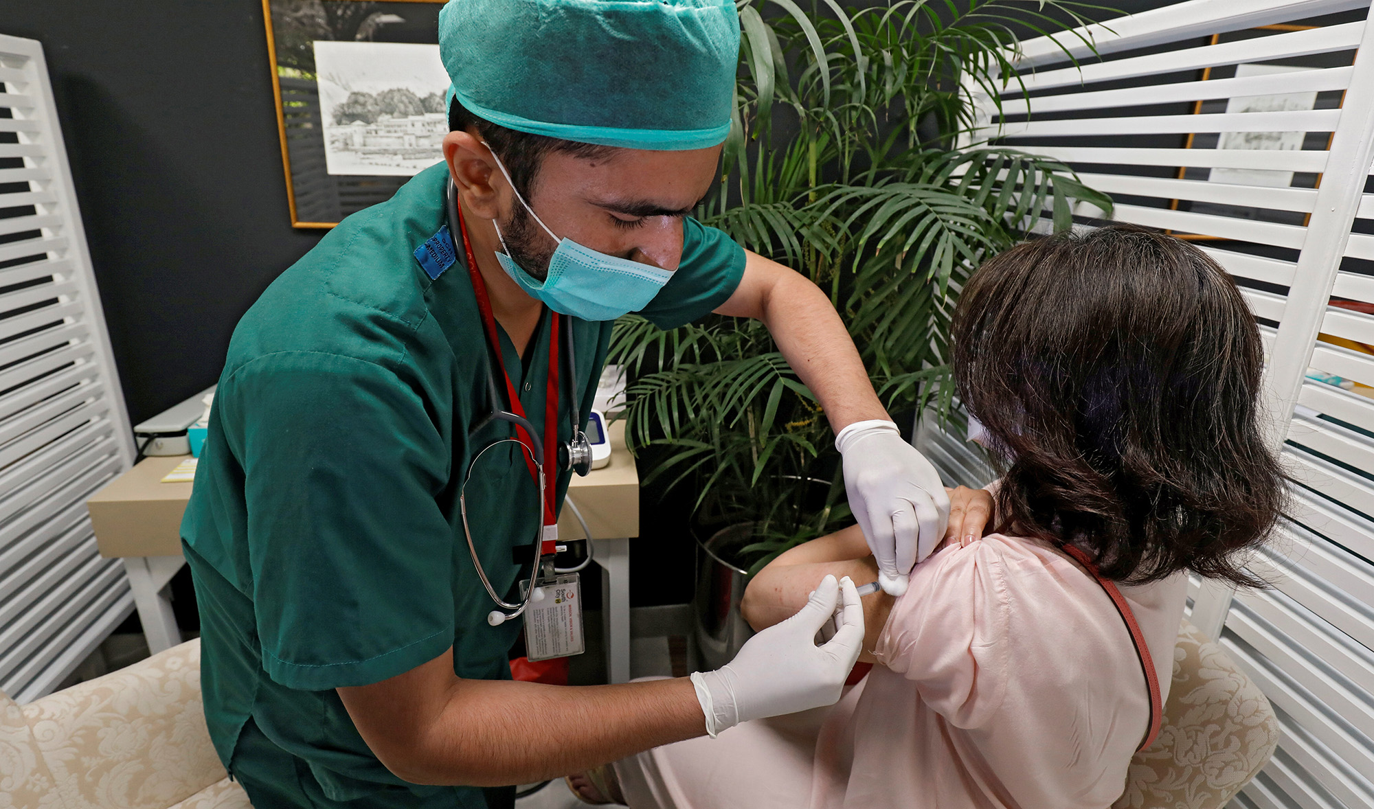 A resident receives a commercial dose of Russia's Sputnik V coronavirus disease (COVID-19) vaccine, at a private hospital in Karachi, Pakistan, on April 4, 2021. (REUTERS)