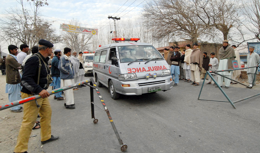 A Pakistani policeman makes way for ambulances in the Swat Valley on March 1, 2008. (AFP/ File)