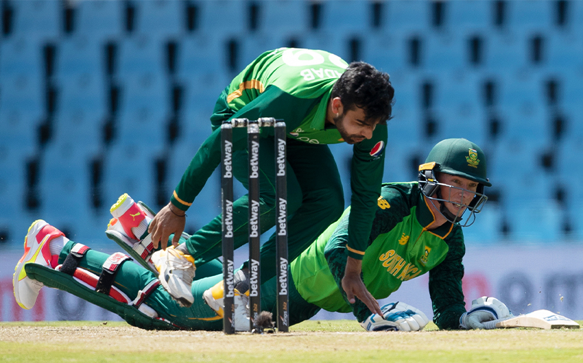 South Africa's batsman Rassie van der Dussen, right, watches the ball after surviving a run out by Pakistan's bowler Shadab Khan during the One Day International cricket match between South Africa and Pakistan in South Africa, on April 2, 2021. (AP)