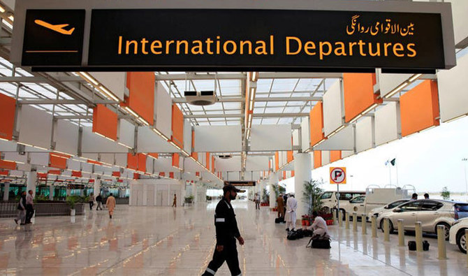 A worker walks at the departure area of the Islamabad International Airport on April 18, 2018. (REUTERS)