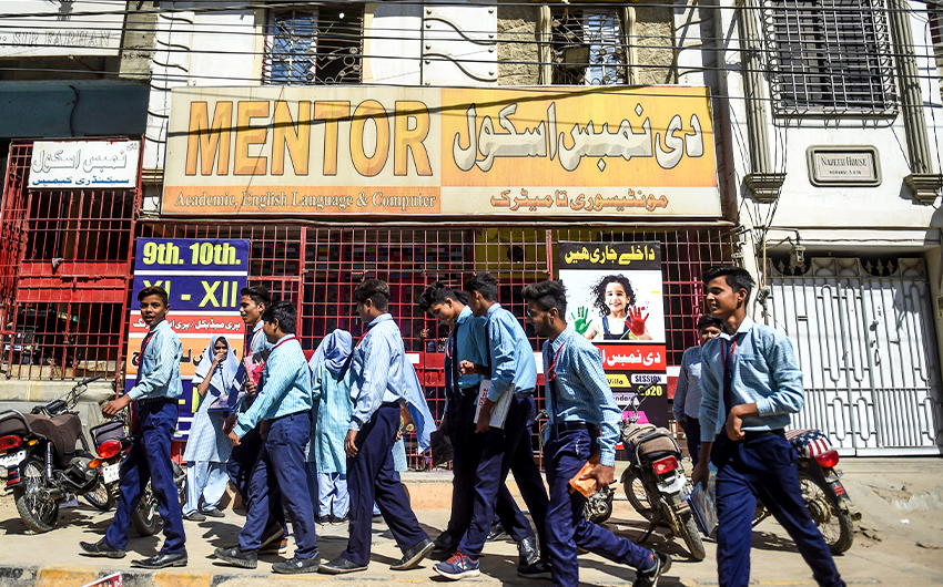 Students leave their school as it is closed by the provincial government that has announced two-day holidays for educational institutions in Karachi, Pakistan, on February 27, 2020. (AFP/File)