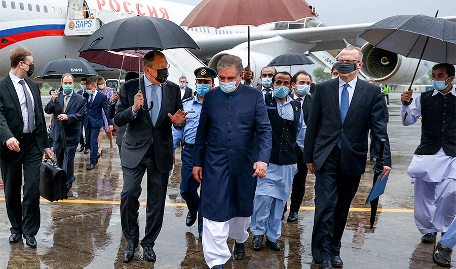 Russian Foreign Minister Sergei Lavrov (2L) meets with his Pakistani counterpart Shah Mahmood Qureshi (C) on his arrival to Islamabad, Pakistan, on April 6, 2021. (AFP)