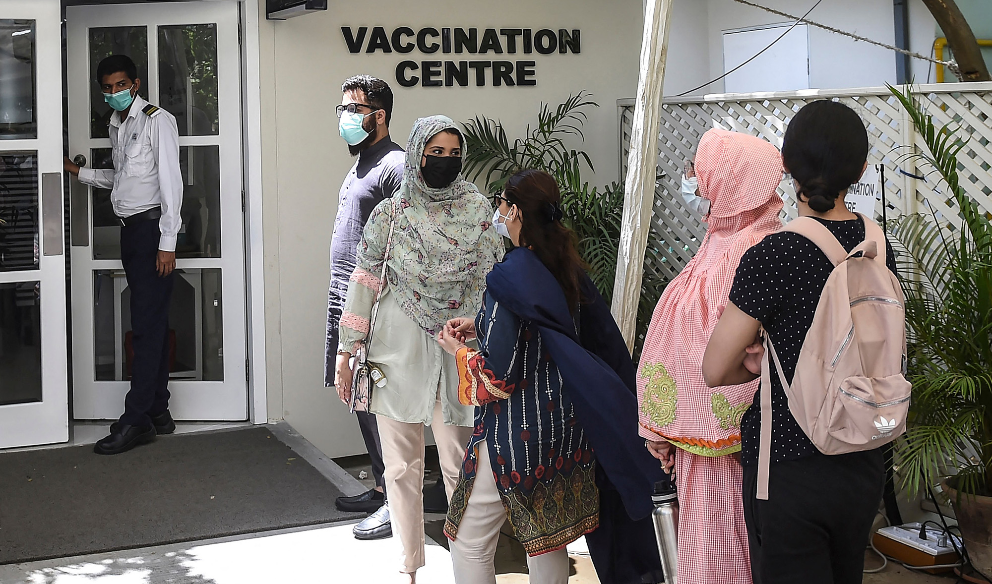 People wait for their turn to receive a dose of the Russia's Sputnik V vaccine against the Covid-19 coronavirus at a vaccination centre in Karachi, Pakistan, on April 5, 2021. (AFP)
