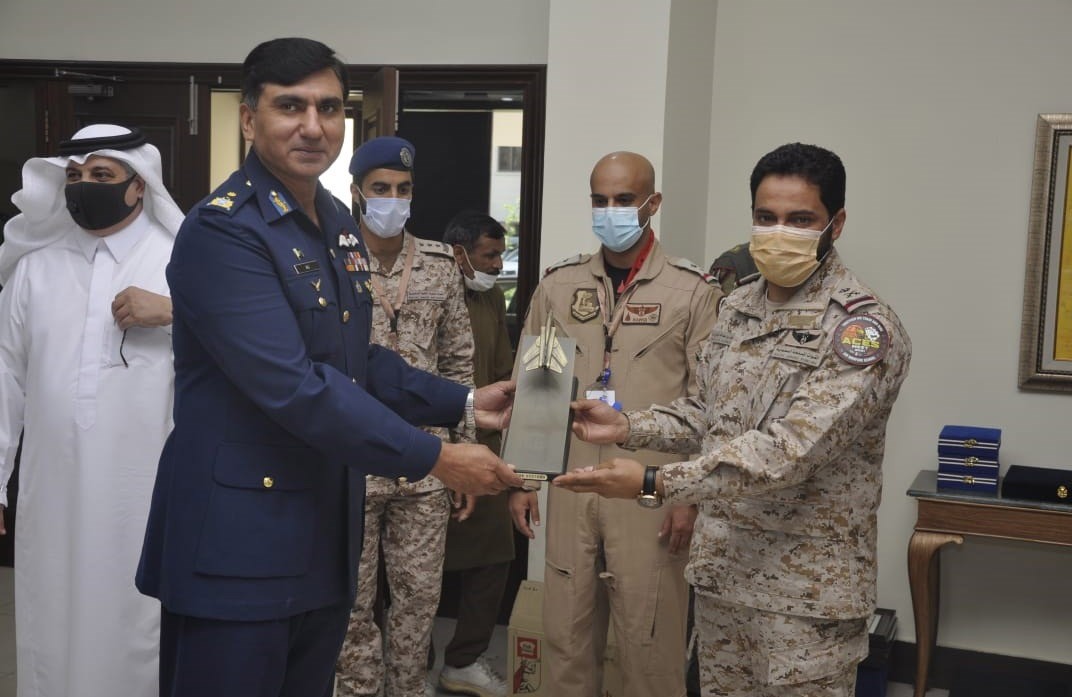 Air Vice Marshal (Pilot) / Staff Awad Abdullah Al Zahrani, Defence Attache KSA (right) presents a souvenir to Base Commander PAF Base Mushaf, Air Commodore Ali Naeem Zahoor (left) , at an operational air base of the Pakistan Air Force, Pakistan, on April 8, 2021. (Courtesy: Pakistan Air Force)