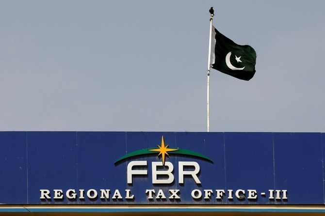The National flag is seen on the Federal Board of Revenue (FBR) office building in Karachi, Pakistan August 29, 2018. (REUTERS)