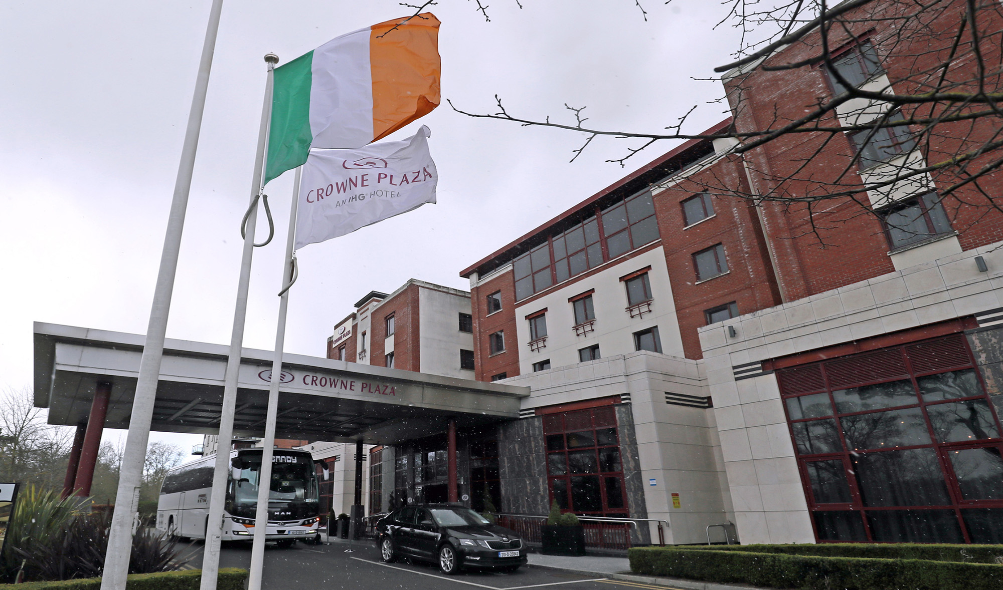 A bus outside the Crowne Plaza hotel near Dublin Airport, where travelers from the high-risk countries will quarantine, in Ireland on March 26, 2021. (Press Association via AP/File)