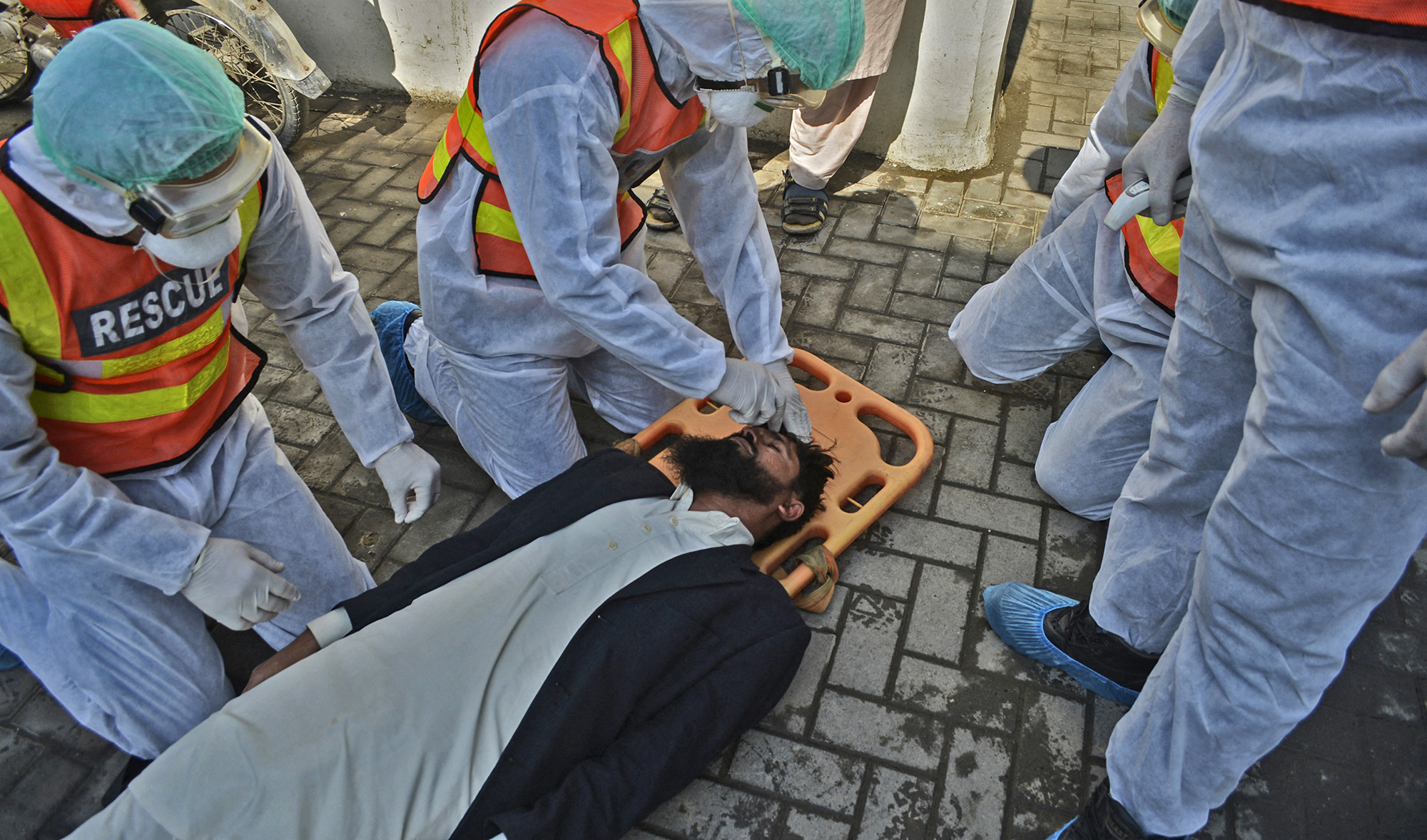 Pakistani rescue personnel take part in drill exercise as a preventive measure for the spread of the of COVID-19 coronavirus, in Peshawar, Pakistan, on March 1, 2020. (REUTERS)
