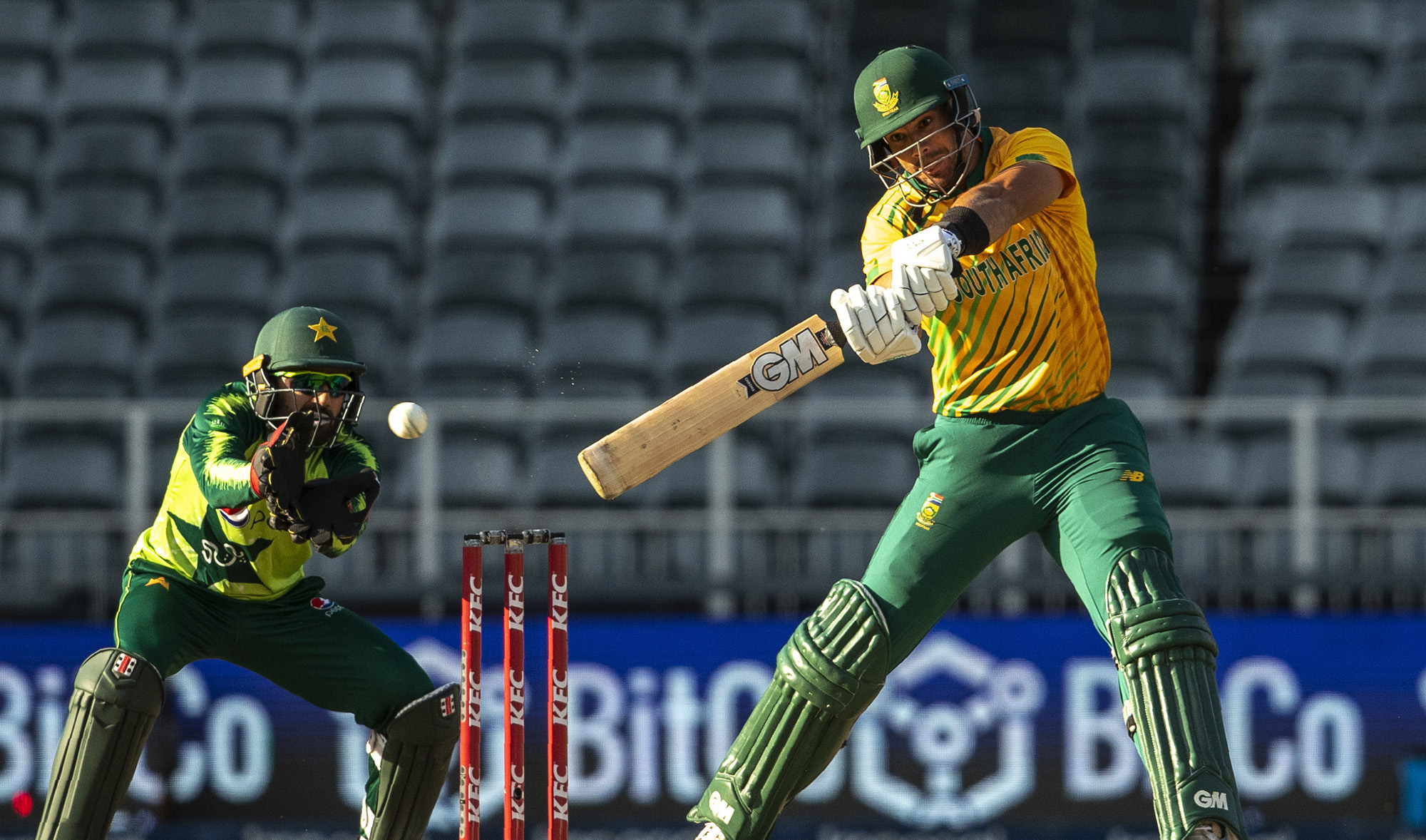 South Africa's batsman Aiden Markram, right, plays a shot as Pakistan's wicketkeeper Mohammad Rizwan watches on during the second T20 cricket match between South Africa in Johannesburg on April 12, 2021. (AP)