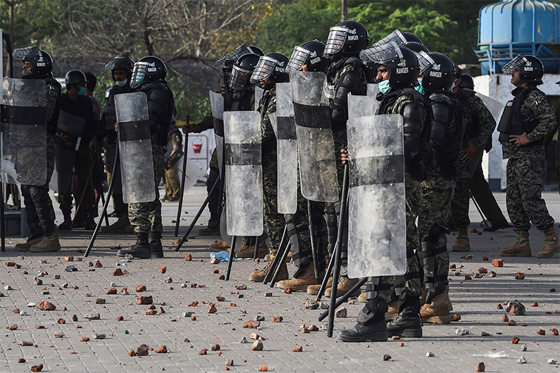 Paramilitary soldiers patrol a blocked street while supporters of Tehreek-e-Labbaik Pakistan (TLP) party protest against the arrest of their leader in Lahore on April 13, 2021. (AFP)