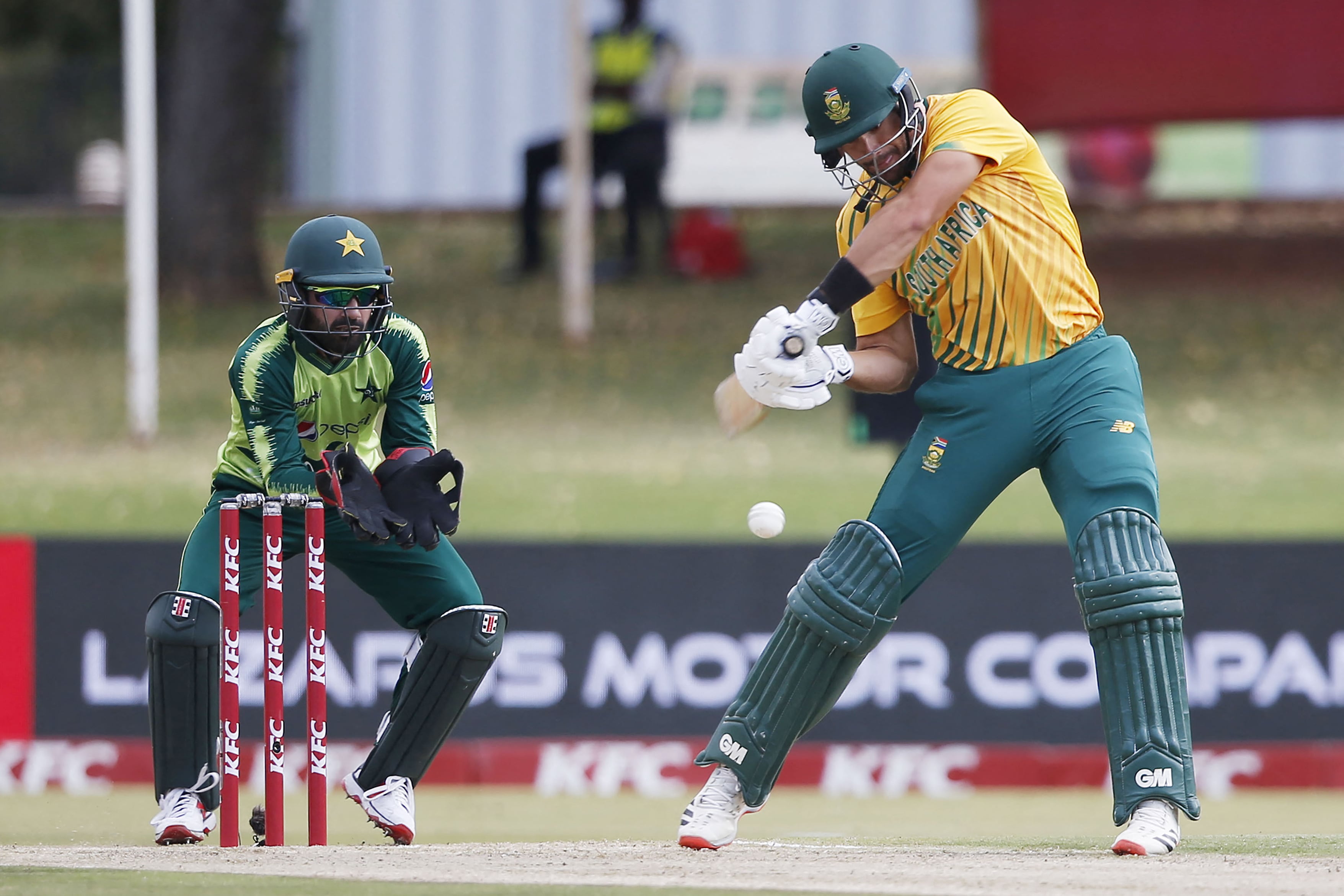 South Africa's Aiden Markram (R) plays a shot as Pakistan's wicketkeeper Mohammad Rizwan (L) looks on during the third Twenty20 international cricket match between South Africa and Pakistan at SuperSport Park in Centurion on April 14, 2021. (AFP)
