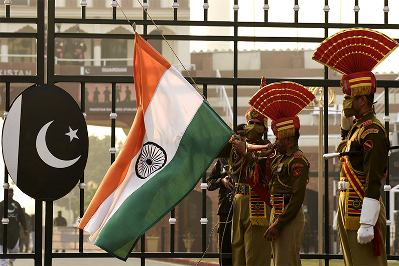 Indian Border Security Force (BSF) soldiers perform during the daily Beating the Retreat ceremony on December 31, 2020. (AFP)