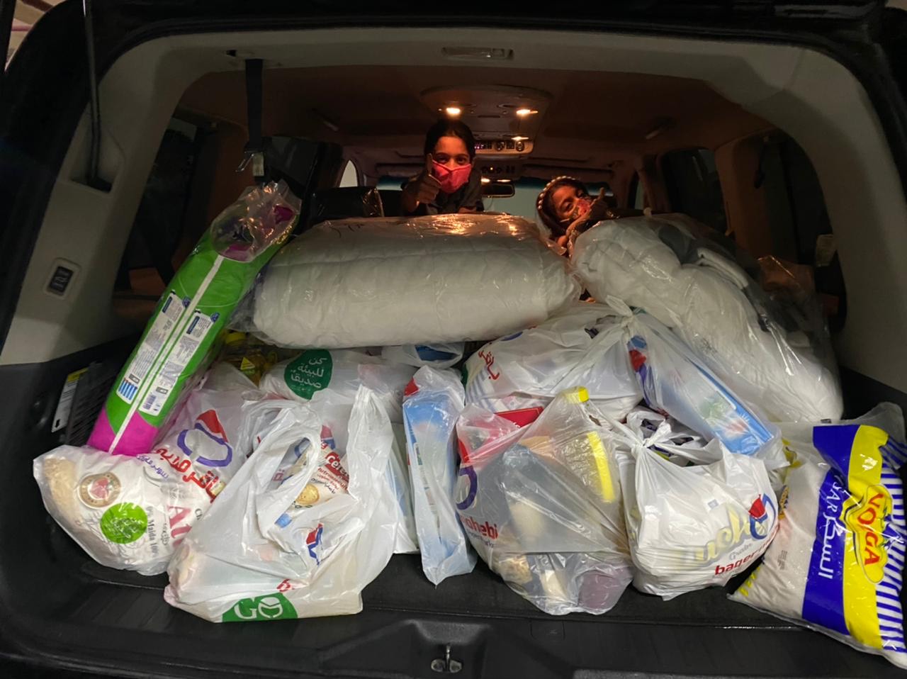 Saeeda Riaz loads her car with food and ration items on April 16 evening to distribute amongst needy families in Ajman. (AN Photo: courtesy Saeeda Riaz)