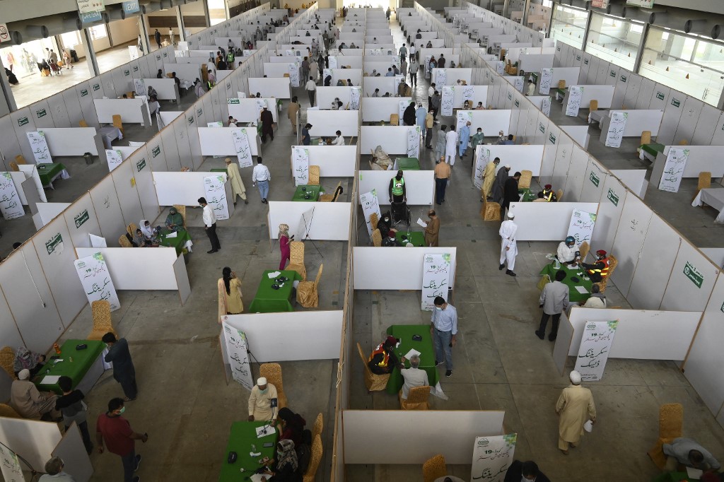 Senior citizens receive doses of the Chinese-made Sinopharm vaccine against the COVID-19 coronavirus at a vaccination center settled inside an Expo Centre in Lahore on April 1, 2021. (AFP/File)