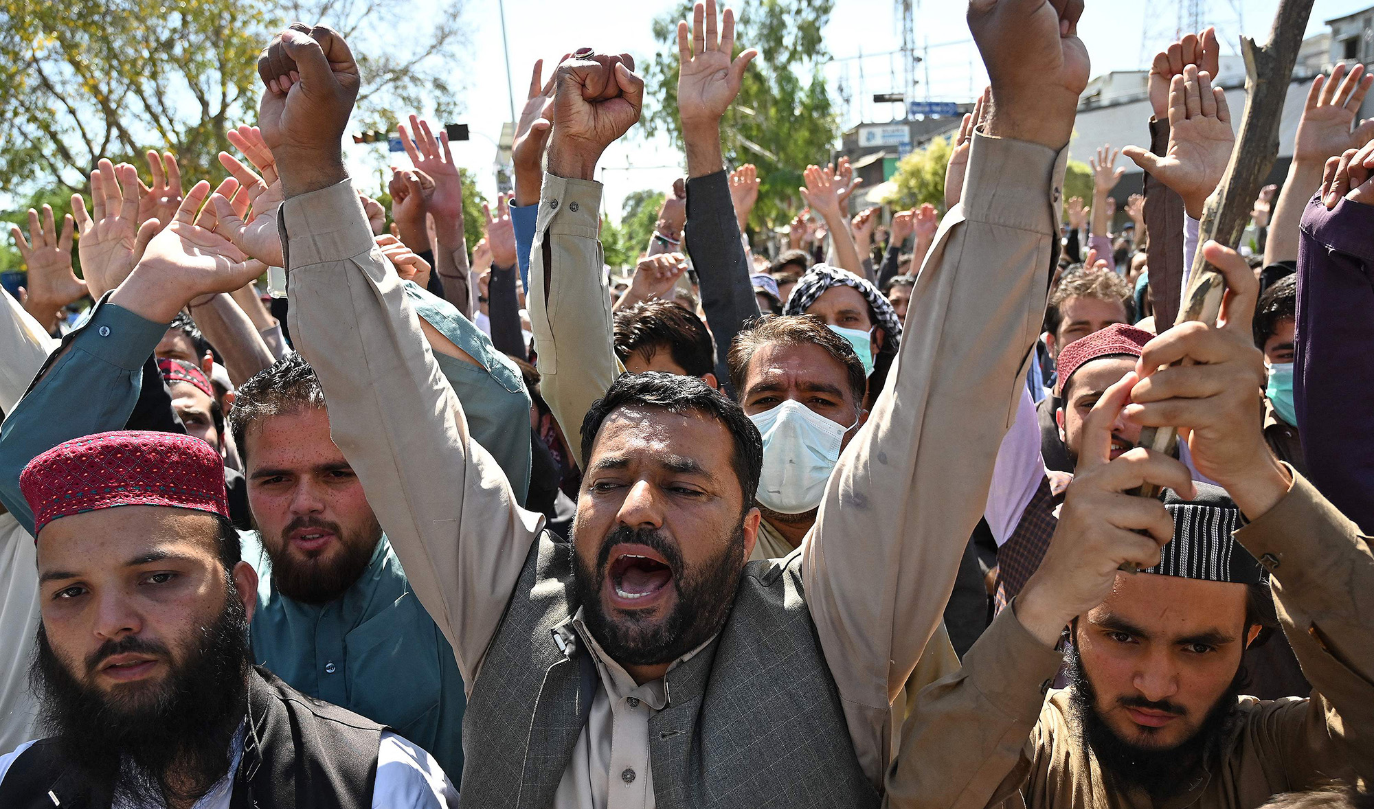 Traders shout slogans as they take part in a protest in Islamabad, Pakistan, on April 19, 2021. (AFP)