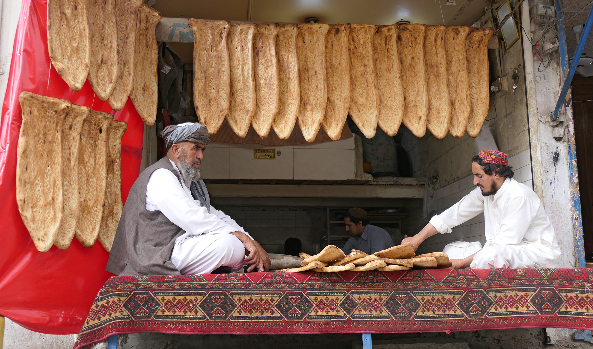 This picture taken on April 18, 2021, shows an Afghan naan shop at Quetta's Bacha Khan Chowk that bakes more than 3,500 traditional breads for its customers during the Muslim fasting month of Ramadan. (AN photo)