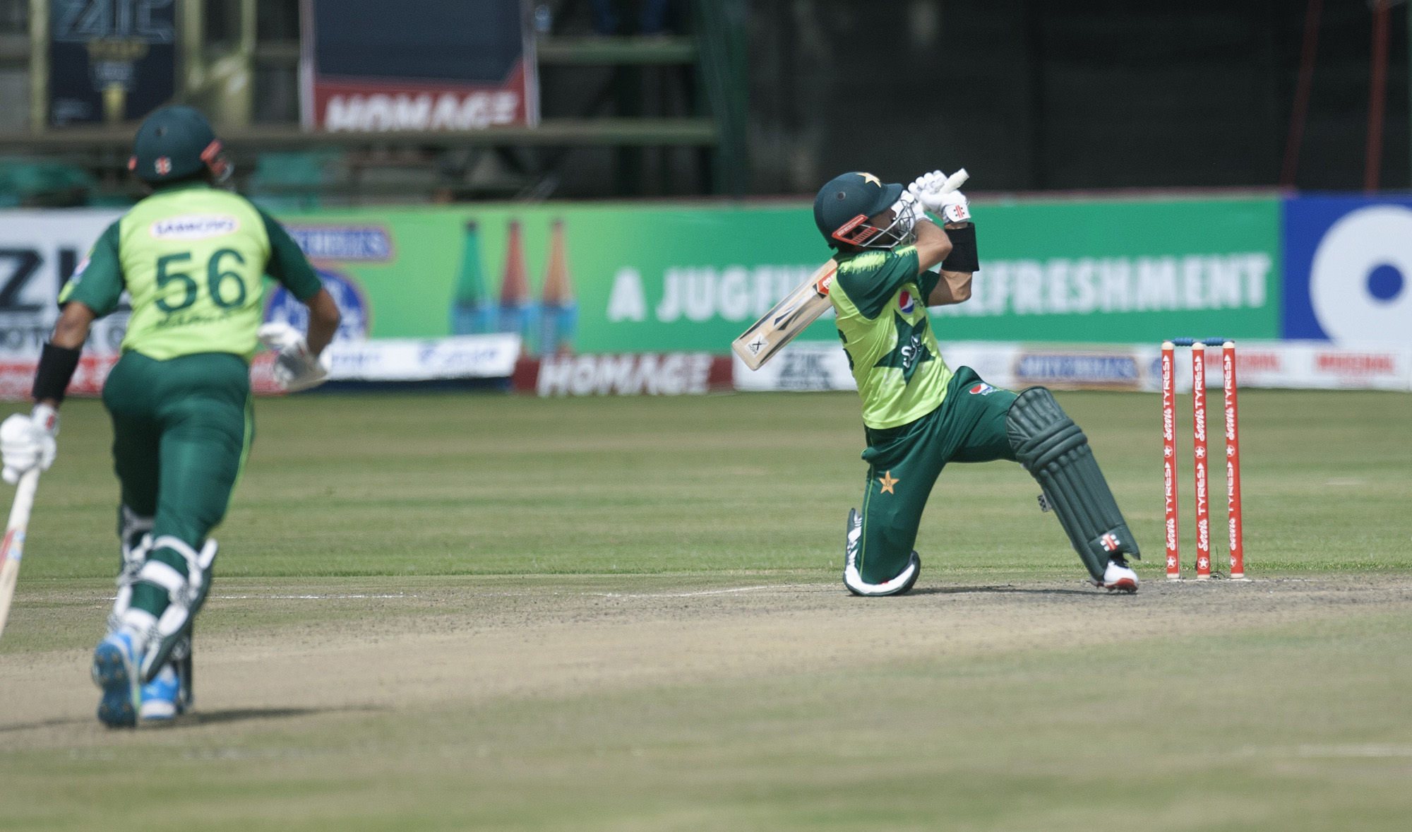 Pakistan batsman Mohammad Rizwan, right, plays a shot during the final cricket T20 match against Zimbabwe at Harare Sports Club, in Harare, Zimbabwe, on April, 25, 2021. (AP)