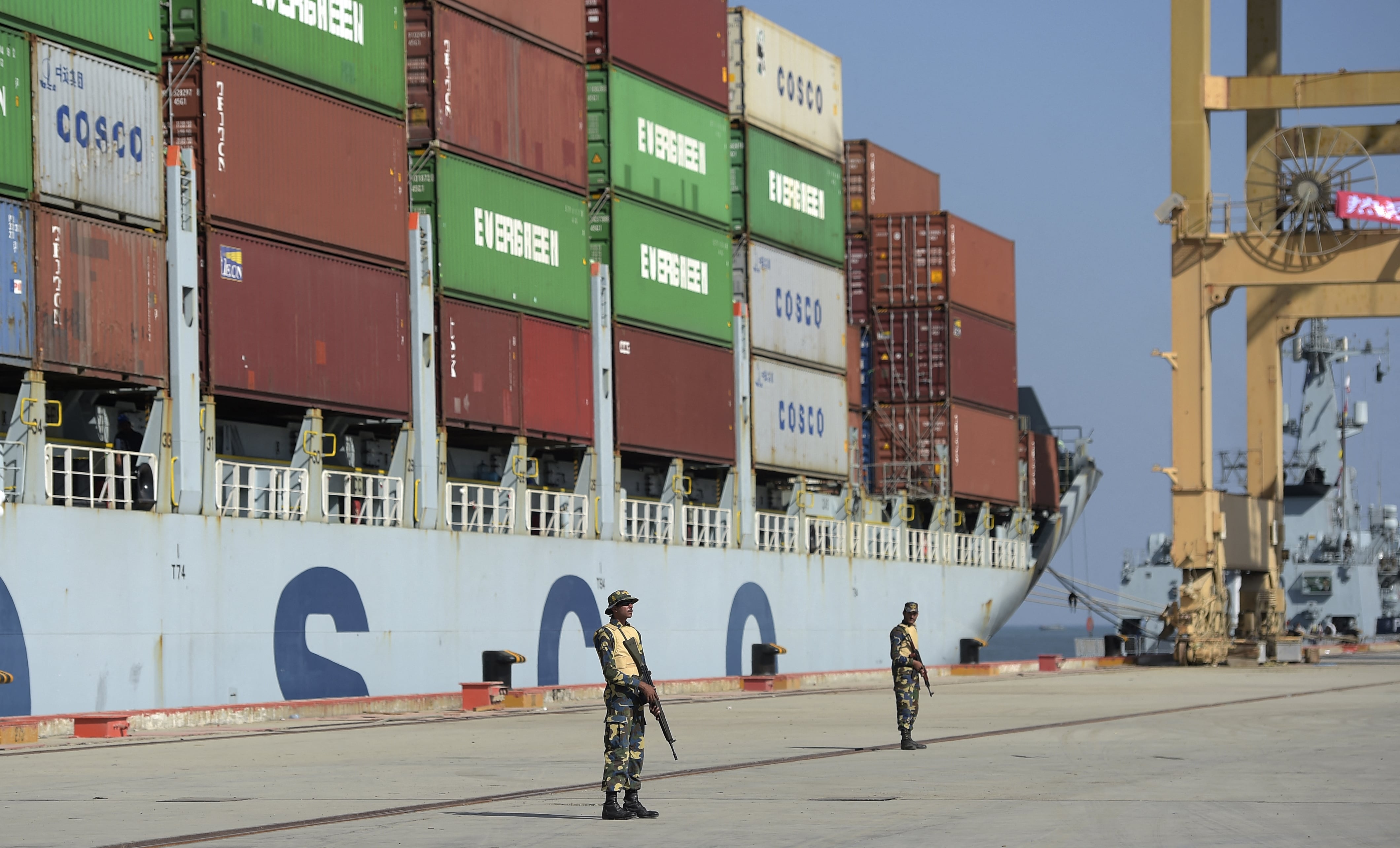In this photograph taken on November 13, 2016, Pakistani Naval personnel stand guard near a ship carrying containers at the Gwadar port, some 700 kms west of Karachi. ( AFP/ File photo)
