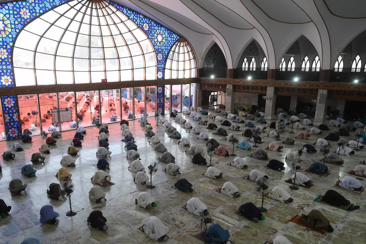 Muslim devotees maintain social distancing as they offer Friday prayers at the Data Darbar Mosque during Islamic holy fasting month of Ramadan in Lahore on May 1, 2020. (AFP/ File)