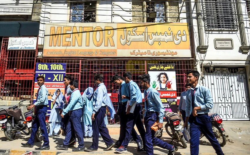 Students leave their school as it is closed by the provincial government that has announced two-day holidays for educational institutions in Karachi, Pakistan, on February 27, 2020. (AFP/File)