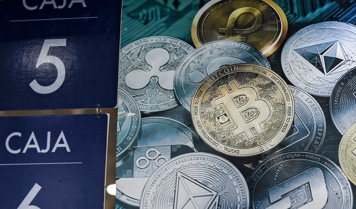 A poster with cryptocurrencies at a store in Caracas, Venezuela, on December 28, 2019. (AFP/File)
