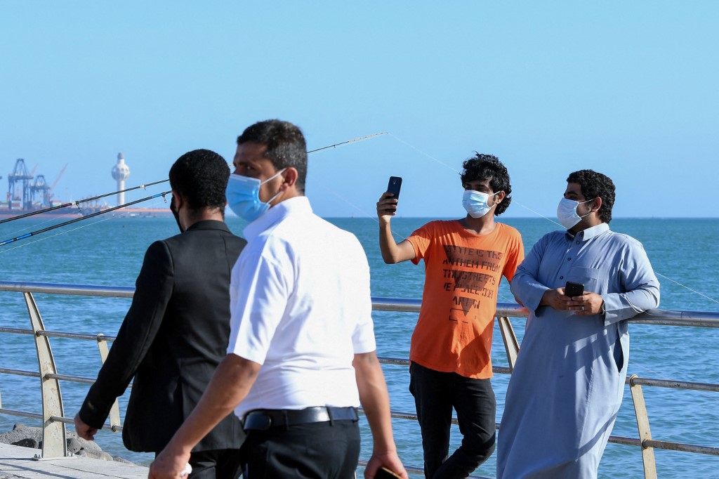 People spend time at the seafront promenade in the Saudi seaport of Jeddah, on June 21, 2020. (AFP/File)