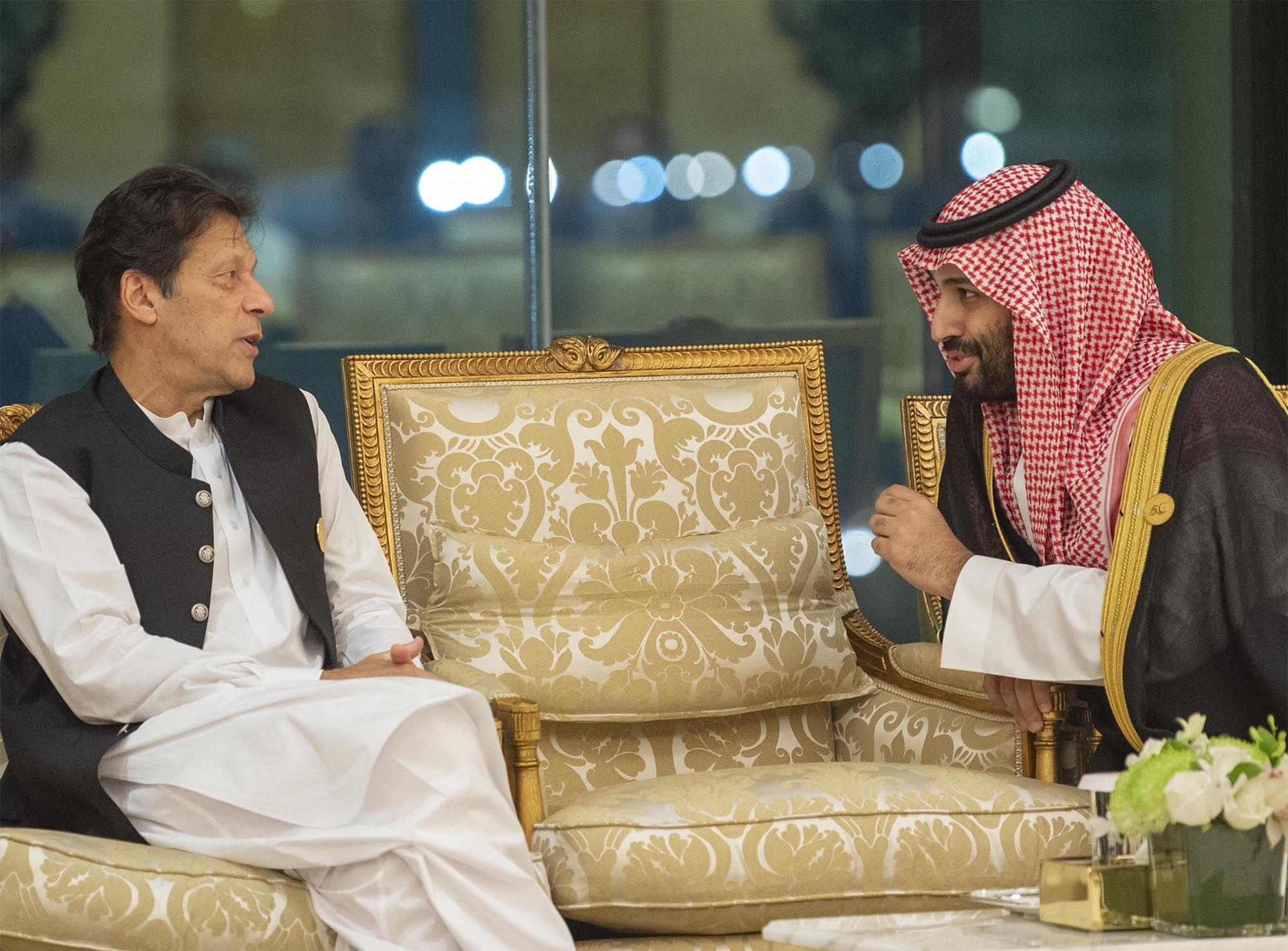 This handout photo released by the Saudi Royal Palace shows Crown Prince Mohammed bin Salman(R) of Saudi Arabia talking to Pakistan's Prime Minister Imran Khan on the sidelines of a summit meeting of the 57-member Organization of Islamic Cooperation (OIC) in the Saudi holy city of Mecca in the early hours of June 1, 2019. (AFP/File)